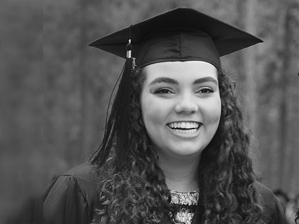 A celebrating graduate of Sierra Nevada College in the commencement procession