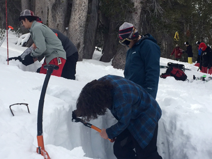 Learning to build a snow cave during AIARE avalanche rescue backcountry safety course