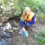 Ashley Vander Meer, a Biology, Outdoor Adventure Leadership and Environmental Science major, tests water in Incline Village