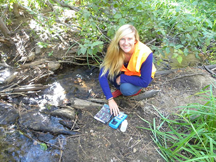 Ashley Vander Meer, a Biology, Outdoor Adventure Leadership and Environmental Science major, tests water in Incline Village