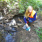 Ashley VanderMeer, major in Biology and Interdisciplinary Studies in Outdoor Adventure Leadership and Environmental Science, working on her Rosewood Creek restoration project.