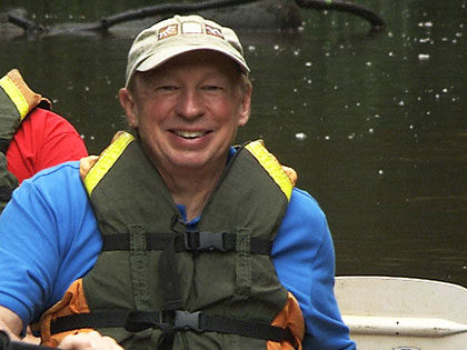 Photo of Sierra Nevada University 2021 commencement speaker Richard Bangs, adventure travel pioneer, in his kayak.