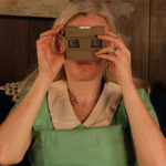 4-D artist Emily Ward Bivens with a 3-D viewer for her exhibition Obscured and Resurfaced at Sierra Nevada College