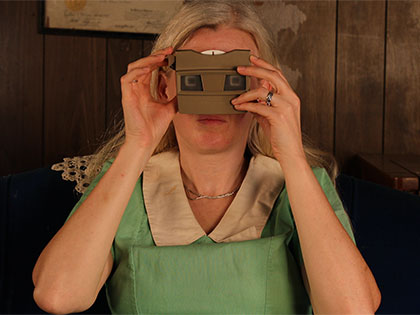 4-D artist Emily Ward Bivens with a 3-D viewer for her exhibition Obscured and Resurfaced at Sierra Nevada College