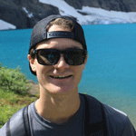 Ski Business & Resort Management student Connor Clayton relaxes lake side