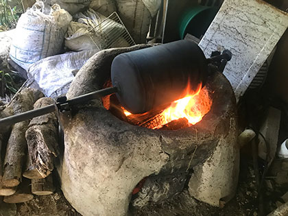 Agua Buena Costa Rica, hand-roasting coffee at a sustainable highland shade-grown coffee plantation
