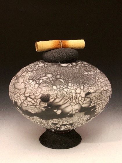 naked raku fired pot with bamboo handle by ceramicist Don Ellis