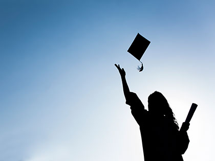 Student completes their bachelors degree in the sun.