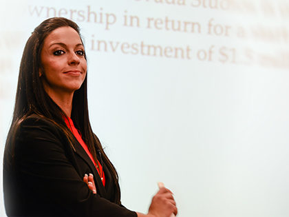 Young woman in dark blazer with long hair at SNU Tahoe College of Entrepreneurial Leadership pitch competition