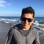 Angel Gonzalez, Psychology major, smiling while at the beach