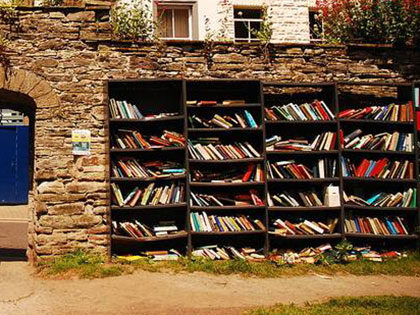 Filled bookshelf in Hay-on-Wye, Wales famous as the Town of Books