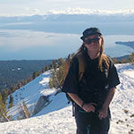 SNU valedictorian Kayla Heidenreich on her snowboard high above Lake Tahoe