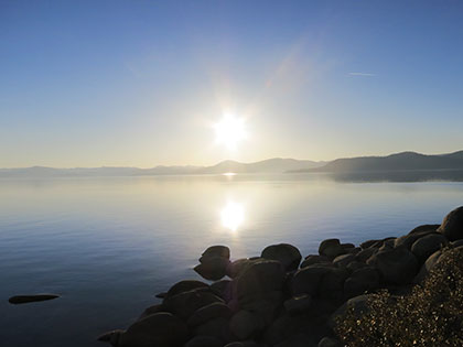 The sun reflected in Lake Tahoe during a summer sunset