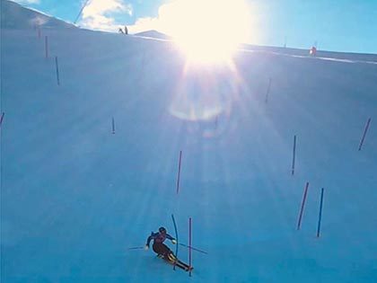 US alpine skier Lila Lapanja running gates as the sun goes behind the hill