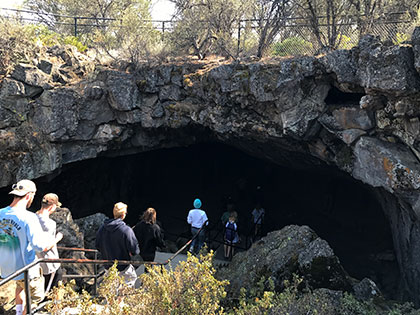Lassen NP - geology students at the entrance to the Subway Cave lava tube