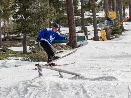 Cole Lyon his the rail during a freeski competition