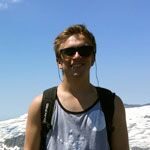 Cole Lyon, free skiier at SNU, takes a break from his Ski Business & Resort Management Homework by hiking in the Tahoe Basin