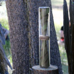 Sculpture of conical screw forms encased in a glass tube from the Sierra Nevada College Master of Fine Arts in Interdisciplinary Art Midway exhibit, at the Sagehen Field Research Station near Truckee California