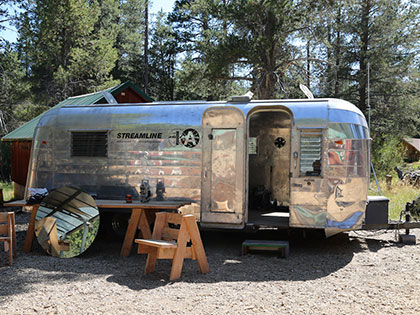 Sierra Nevada College Fine Arts traveling Airstream exhibition trailer for the MFA in Interdisciplinary Arts residency at Sagehen Creek Field Station in Truckee CA