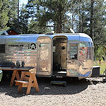 Sierra Nevada College Fine Arts traveling Airstream exhibition trailer for the MFA in Interdisciplinary Arts residency at Sagehen Creek Field Station in Truckee CA