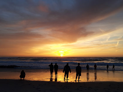 A spectacular sunset on the beach in Monterey during a Sierra Nevada College science trip.