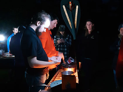 Sierra Nevada College science students cook a late dinner at the Veteran's Memorial Park campground in Monterey at the Monterey Aquarium during the science department spring trip