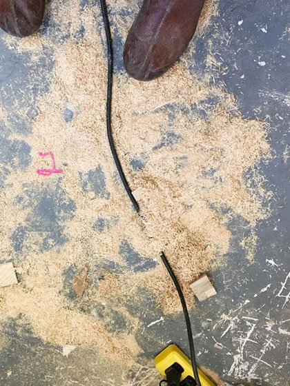 sawdust on the floor, a shop image from woodworking artist Sasha Petrenko