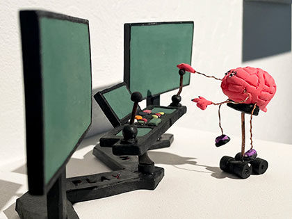 sculpture by Victor Herrera brain robot with computer screens