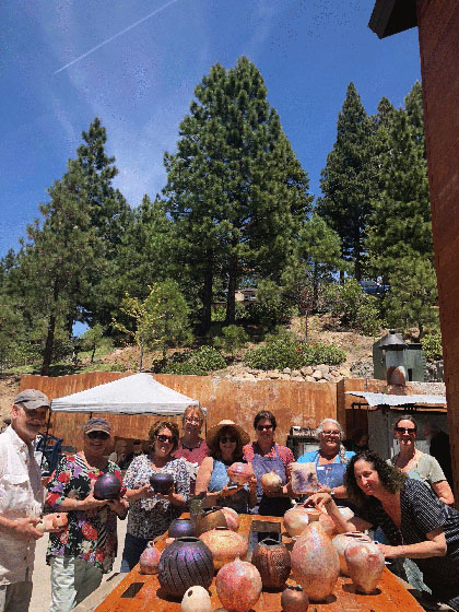 ceramics students in Don Ellis and Randy Brodnax summer arts fast fire pottree workshop at Sierra Nevada University with their work