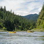 oar boats enjoy a quiet spot on the river - Sierra Nevada University environmental science and outdoor adventure leadership students in field courses on the Wild and Scenic Rogue River