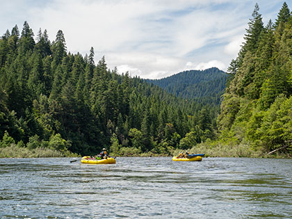oar boats enjoy a quiet spot on the river - Sierra Nevada College environmental science and outdoor adventure leadership students in field courses on the Wild and Scenic Rogue River