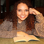 English major Nicole Ross reads in Prim Library at SNU Tahoe