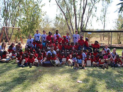 Students in Sierra Nevada University's South Africa Service Learning course with children at a rural preschool for International Play Day.