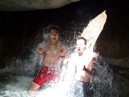 Taking a dip into a waterfall in South Lake Tahoe, International Students feel the chill of snow run off.