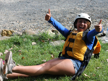 student is ready for whitewater rafting at Sierra Nevada College orientation river camp adventure