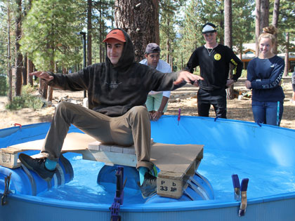float test - students have built a boat out of scrap materials for a creativity workshop at the Sierra Nevada College orientation
