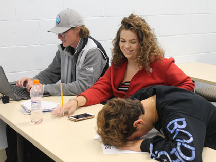 a student is overwhelmed during an entrepreneurship workshop as two other students look on at the Sierra Nevada College orientation