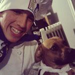 Entrepreneurship student Joseph Schembri cooks with his best friend, his dog