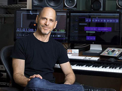 composer Jan Stevens at his piano