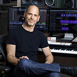 composer Jan Stevens at his piano