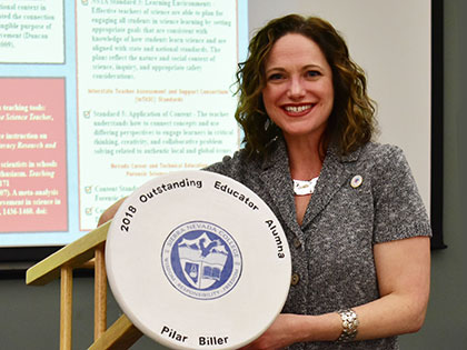 Pilar Biller, 2018 Nevada Teacher of the Year, receiving the SNC Outstanding Educator Alumni Award at the 2018 Sierra Nevada College Teacher Education Graduate Symposium on March 19