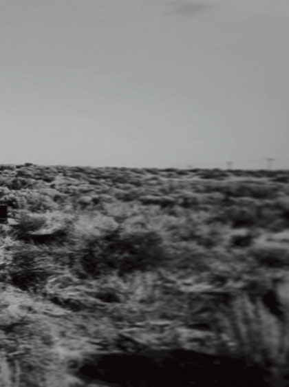 black and white photograph of barren landscape - THIS SIDE OF LOST by artist Hasler R Gomez