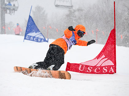Sierra Nevada University snowboarder in the GS at the 2022 USCSA nationals in Lake Placid