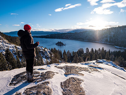 SNC Tahoe students look down at Tahoe's Emerald Bay, while the Lake Tahoe basin is covered in snow.