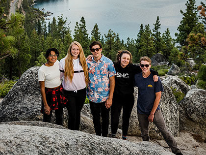 Sierra Nevada University students on a mountain high above Lake Tahoe
