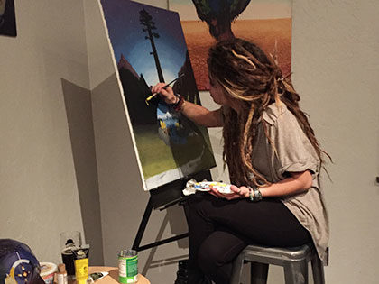 Fine Arts Student Sidney Pinkerton works on painting project