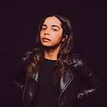 Curator and art programmer Ashley Stull Meyers in her black leather motorcycle jacket.