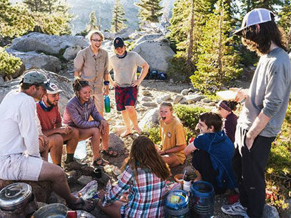 Sierra Nevada University students cooking dinner on a Sierra Nevada backpacking trip
