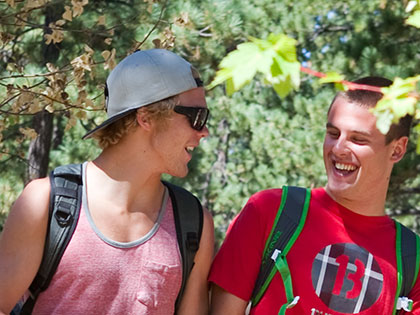 Students casually discuss homework while walking to class at SNC Tahoe