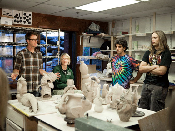 ceramics students with their work at Sierra Nevada University